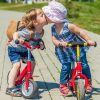 Two kids on balance bike